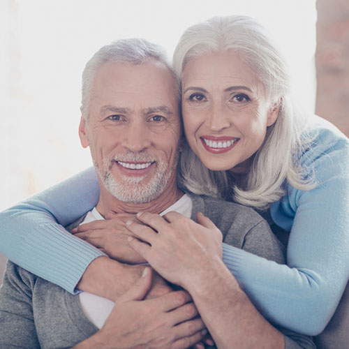 Old Couples had a perfect smiles hugging each other