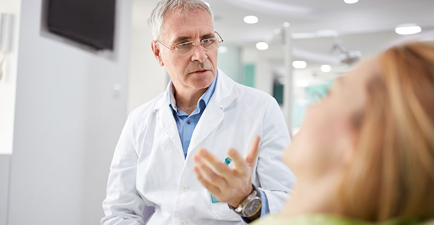 Dentist explaining something to a patient